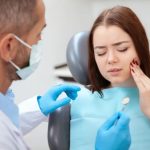 a woman is getting dental treatment