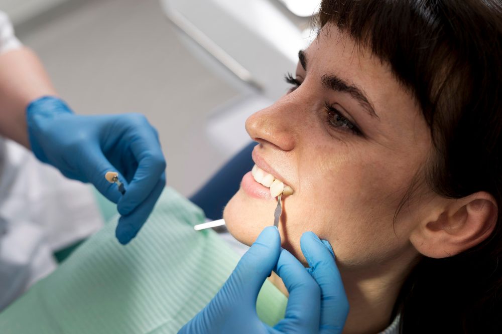 a woman is getting dental treatment